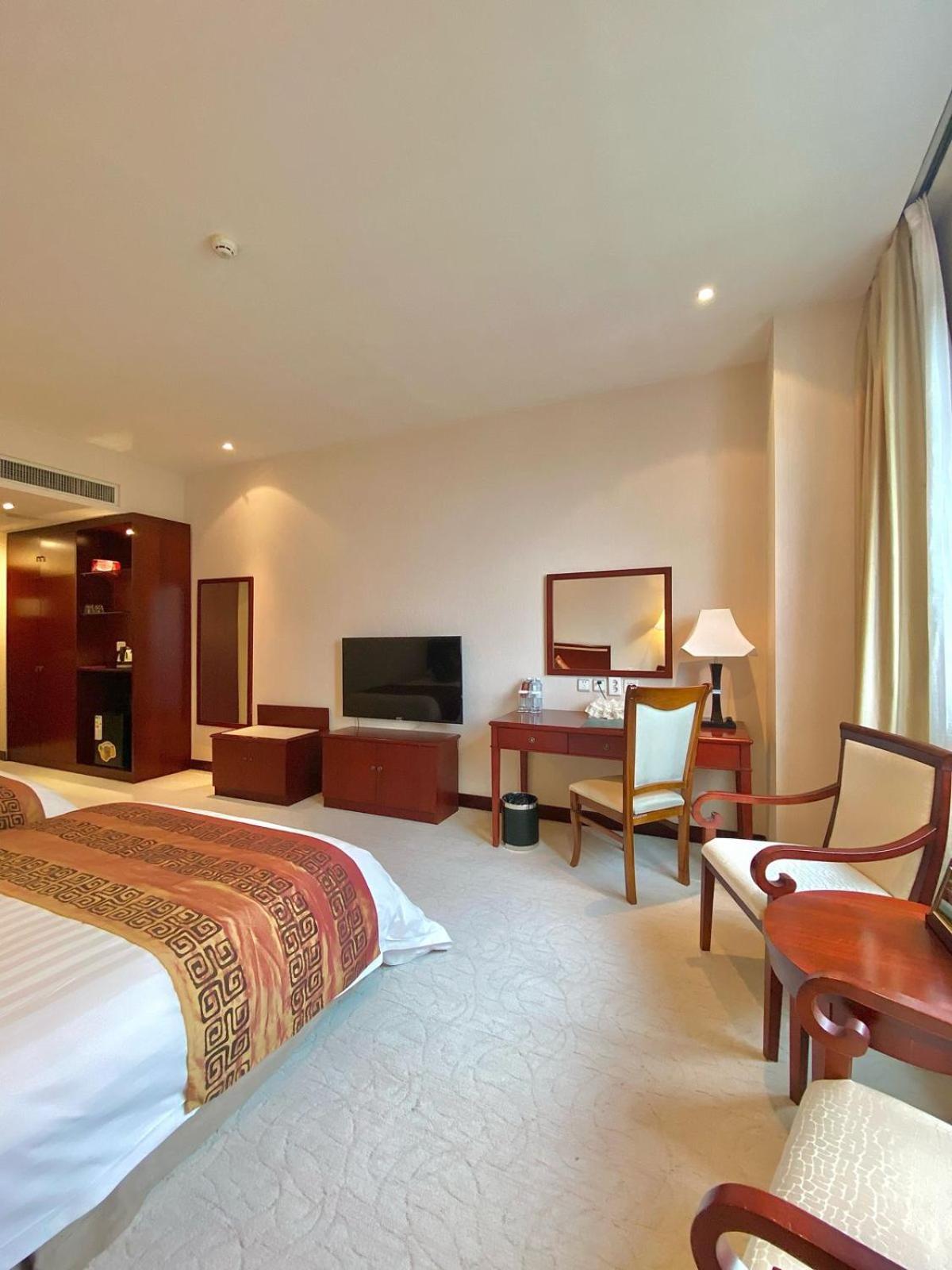 โรงแรม เบจิง พาเลซ โซลักซ์ แอสทานา อัสตานา ภายนอก รูปภาพ A room at the hotel